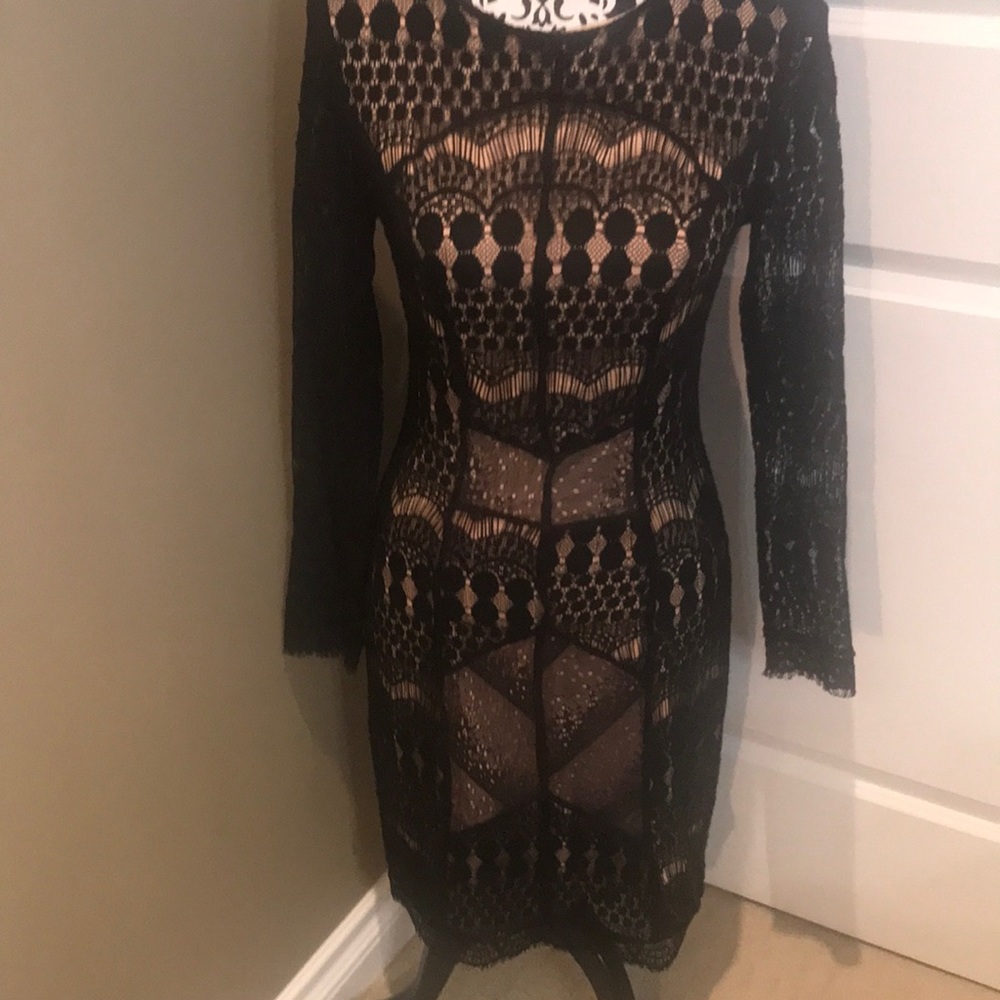 Gorgeous black lace long sleeved  dress with nude lining.
